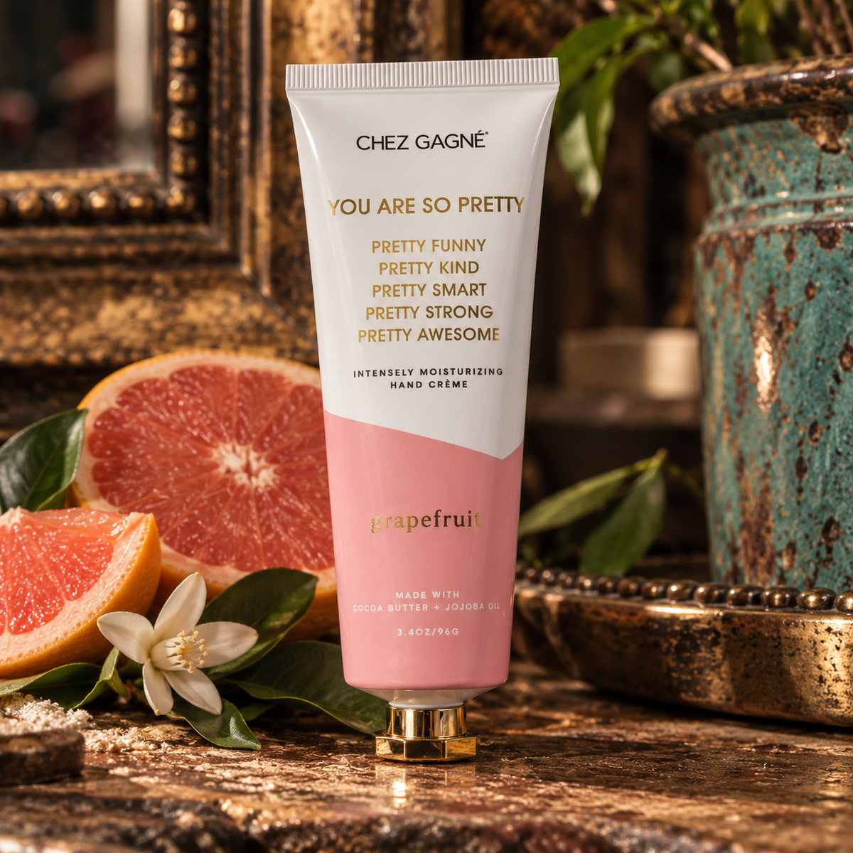Chez Gagné You Are So Pretty Grapefruit hand crème in a warm Madame Peacock's styled setting