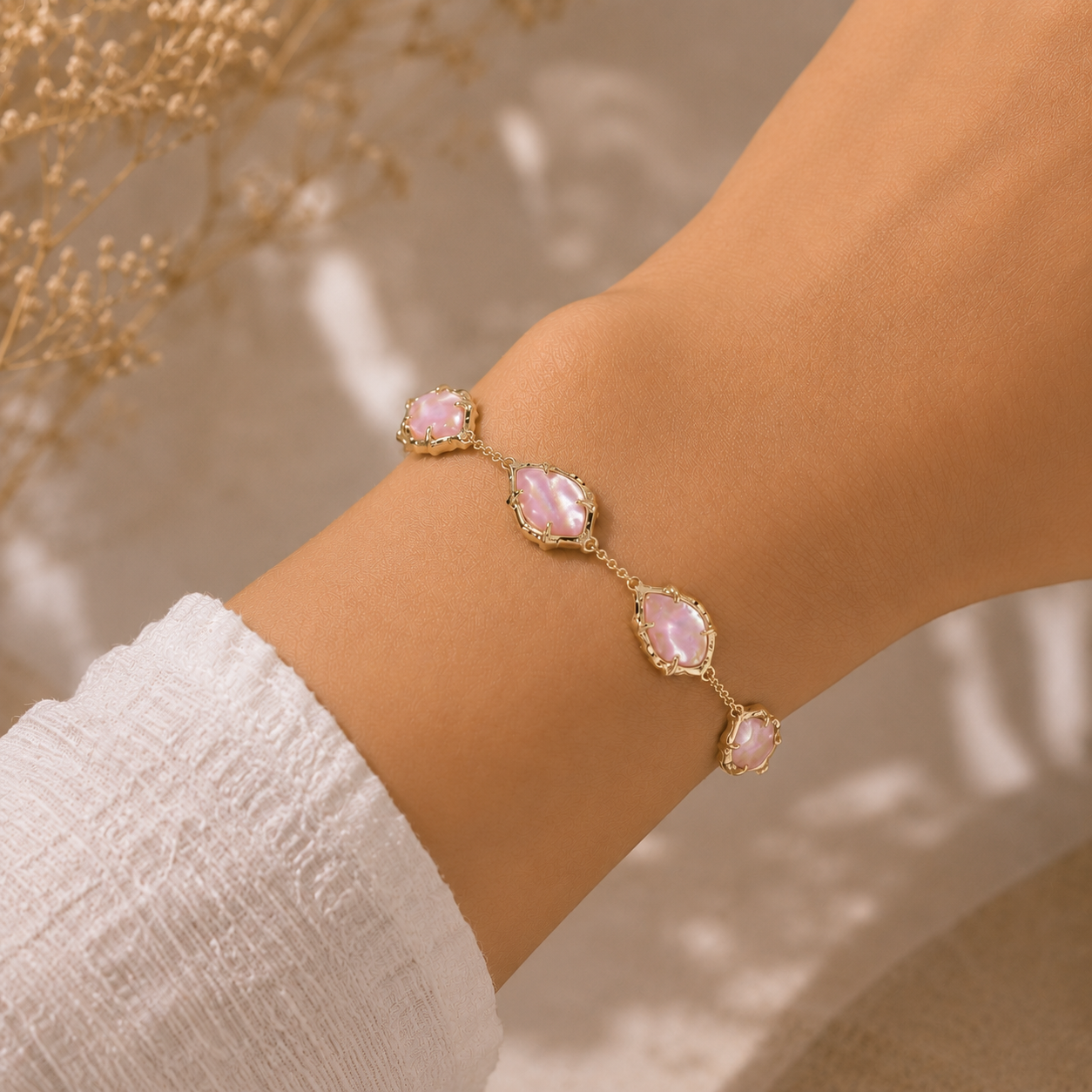 Gold Light Pink Iridescent Abalone Kendra Scott Adriana bracelet worn on wrist