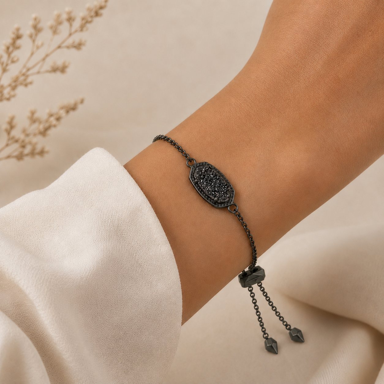 Kendra Scott Elaina Black Drusy bracelet worn on wrist with gunmetal chain and adjustable closure