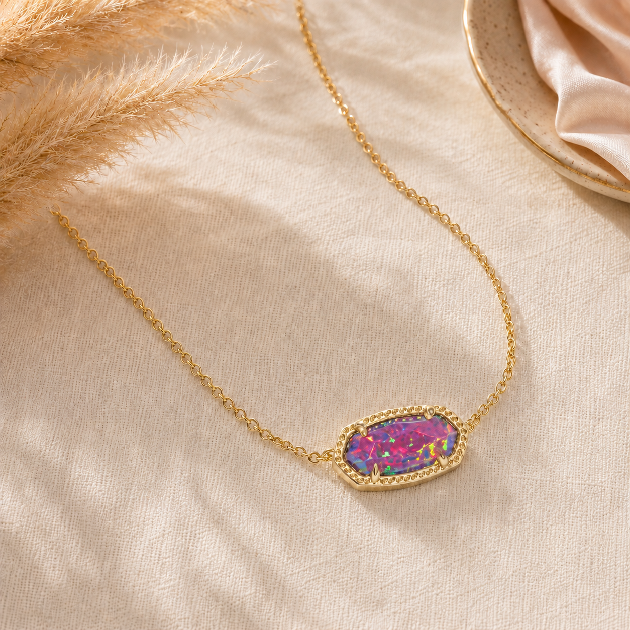 Kendra Scott Elisa Pendant Necklace in Gold Dark Lavender Kyocera Opal with an elongated oval pendant and delicate gold chain