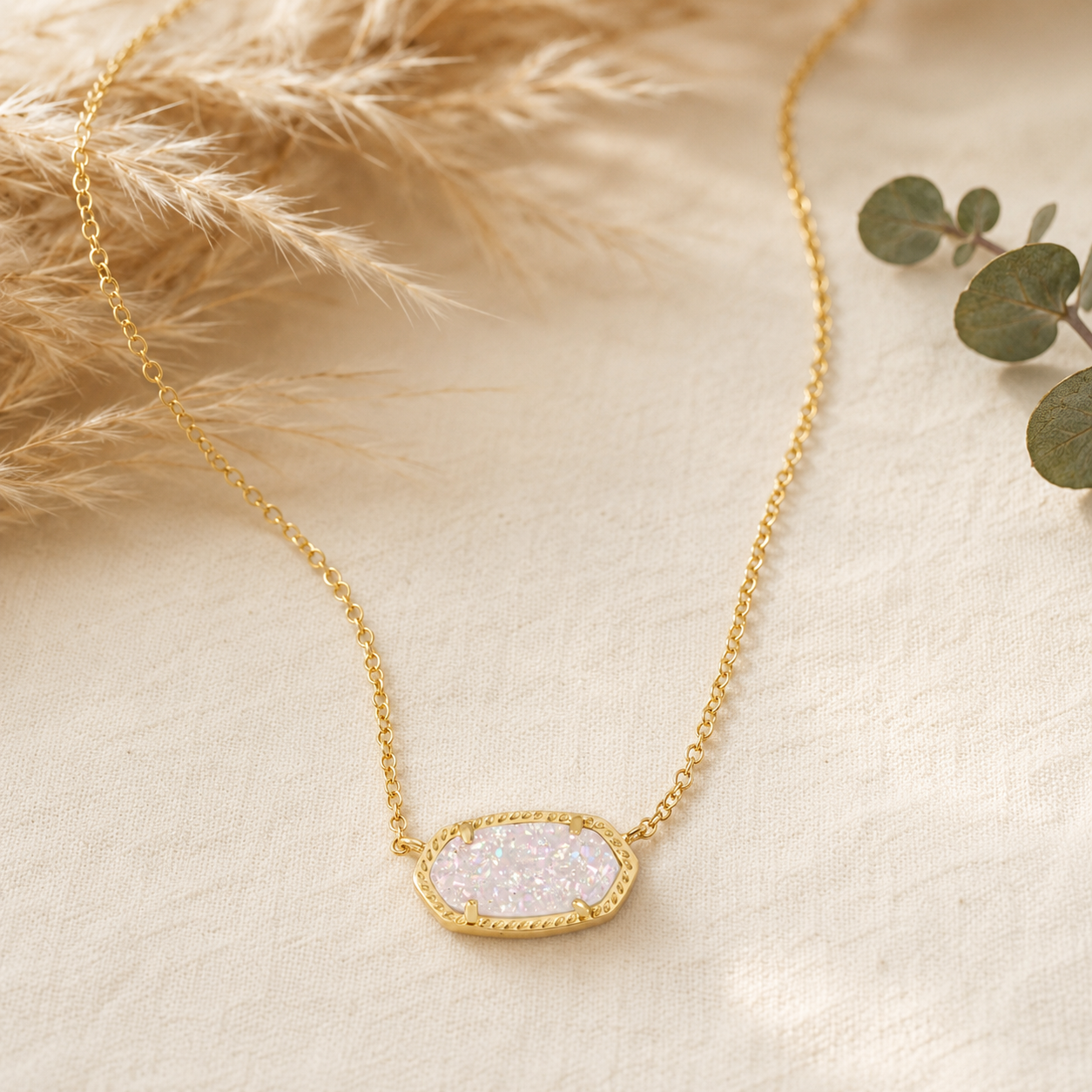 Kendra Scott Elisa Short Pendant Necklace in Gold Iridescent Drusy with a sparkling oval pendant on a delicate gold chain