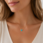 Kendra Scott Ari Heart Gold Turquoise Magnesite Short Pendant Necklace worn on model with delicate heart charm