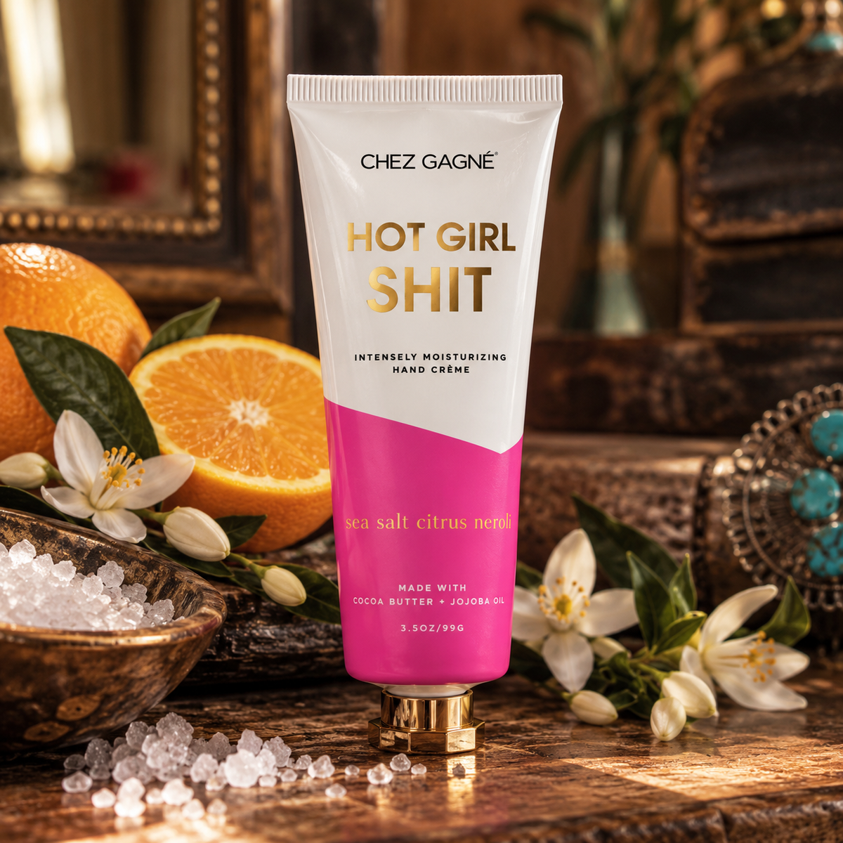 Chez Gagné Hot Girl Shit Sea Salt Citrus + Neroli hand crème in a warm Madame Peacock's styled setting
