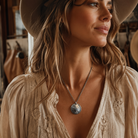 Genuine Indian Head nickel pendant necklace styled with a cream lace western blouse and cowboy hat.