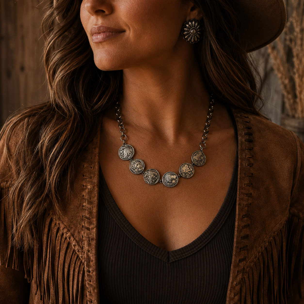 Western-inspired coin necklace modeled with a brown fringe jacket and dark knit top, showcasing an 18-inch genuine Indian Head nickel statement necklace in a rustic, moody setting.