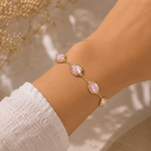 Gold Light Pink Iridescent Abalone Kendra Scott Adriana bracelet worn on wrist