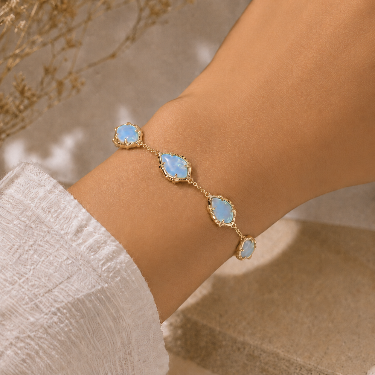 Gold Sky Blue Iridescent Abalone Kendra Scott Adriana bracelet worn on wrist