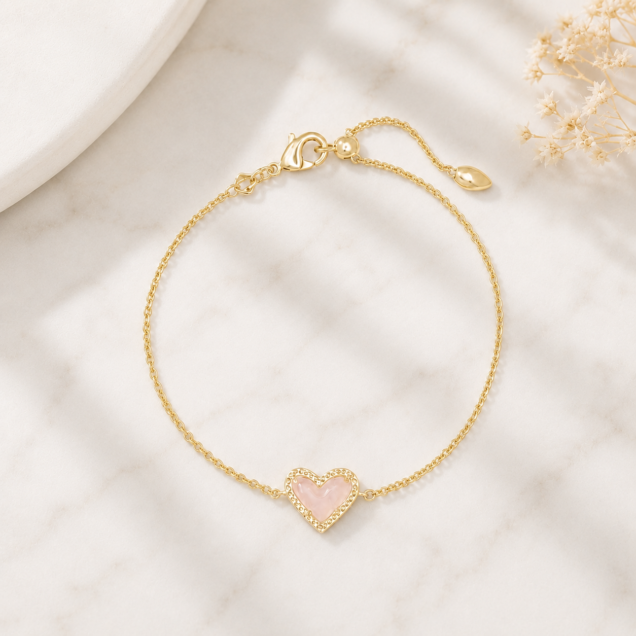 Kendra Scott Ari Heart Gold Delicate Chain Bracelet in Rose Quartz with heart-shaped stone