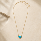 Kendra Scott Ari Heart Gold Short Pendant Necklace in Turquoise Magnesite with heart pendant and adjustable chain with lobster clasp
