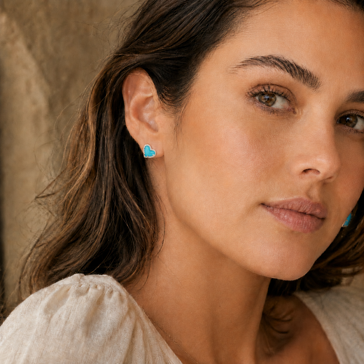 Kendra Scott Ari Heart Silver Turquoise Magnesite Stud Earrings worn on ear with romantic heart-shaped design