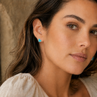 Kendra Scott Ari Heart Silver Turquoise Magnesite Stud Earrings worn on ear with romantic heart-shaped design