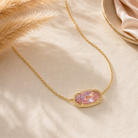 Kendra Scott Elisa Pendant Necklace in Gold Light Mauve Illusion with a faceted pink oval pendant and delicate gold chain