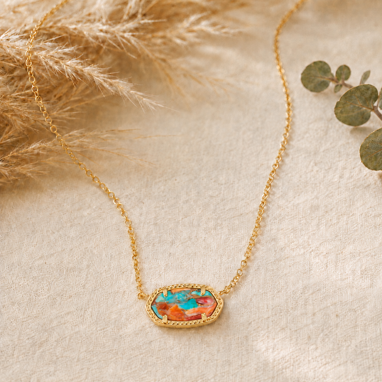 Kendra Scott Elisa Short Pendant Necklace in Gold Bronze Veined Turquoise Magnesite Red Oyster with a multicolor oval pendant