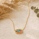 Kendra Scott Elisa Short Pendant Necklace in Gold Bronze Veined Turquoise Magnesite Red Oyster with a multicolor oval pendant