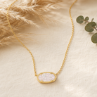 Kendra Scott Elisa Short Pendant Necklace in Gold Iridescent Drusy with a sparkling oval pendant on a delicate gold chain