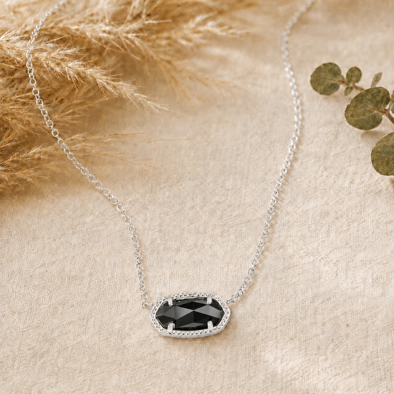 Kendra Scott Elisa Short Pendant Necklace in Silver Black with a faceted black oval pendant on a delicate silver chain