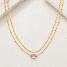 Kendra Scott Emilie Multi Strand Necklace in Gold Purple Amethyst with layered chains and faceted purple oval pendant