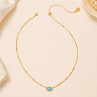 Kendra Scott Mini Elisa Gold Satellite Short Pendant Necklace in Turquoise Magnesite with blue-green pendant